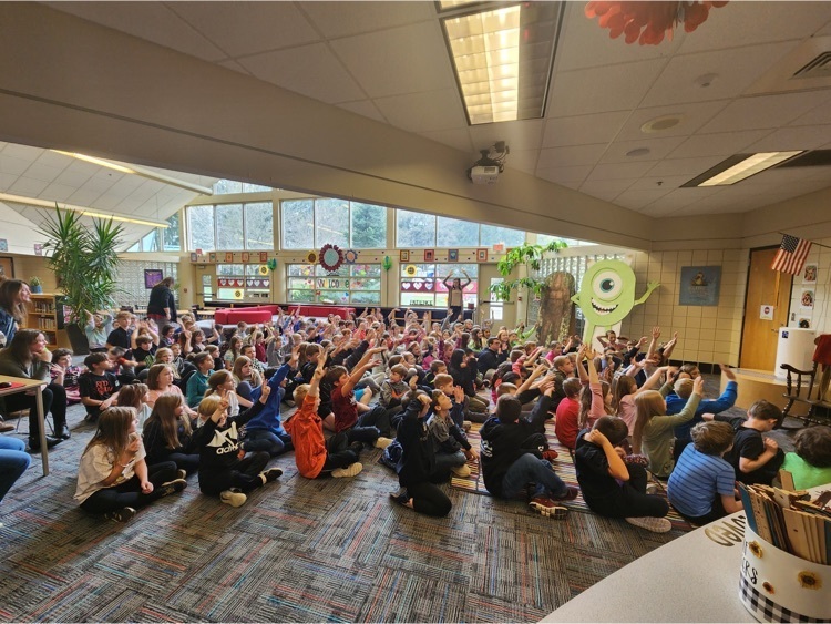 School board member, Tom Baneyreading to a fifth grade classroom.