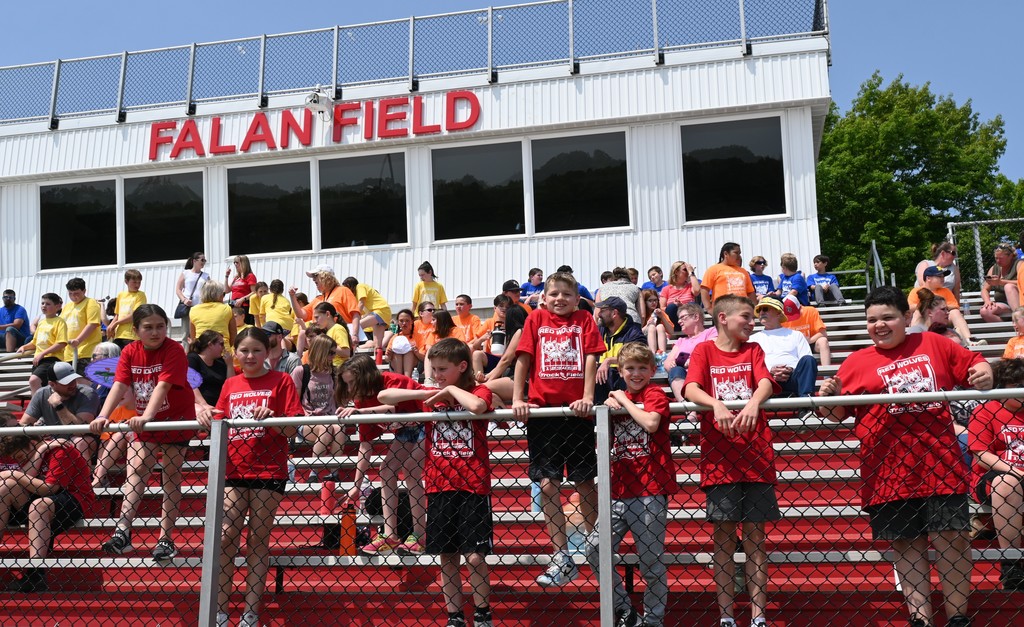 students in stands at Falan Field