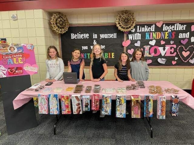 Picture of Girls On The Run participants holding a fundraiser for Bronson’s Children’s Hospital.