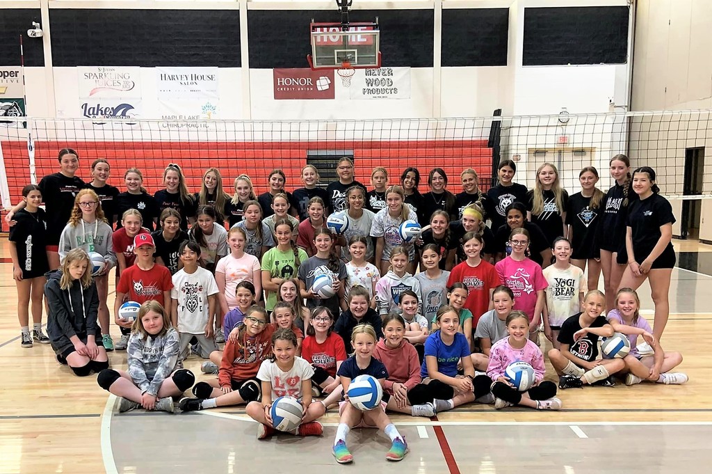 50+ students and coaches at PPPS volleyball camp in gym