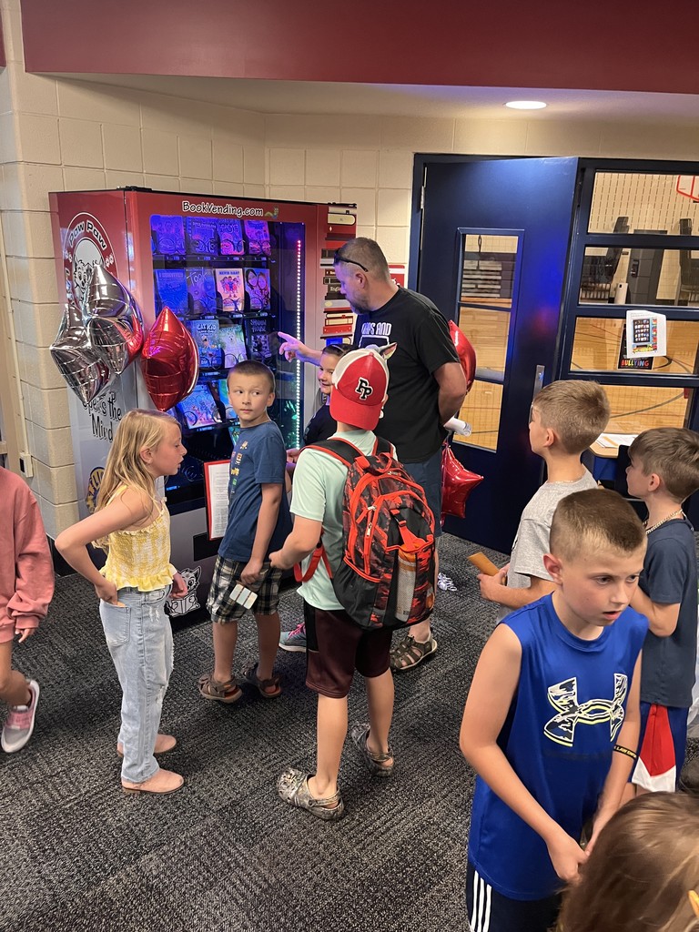kids excited to see the book vending machine