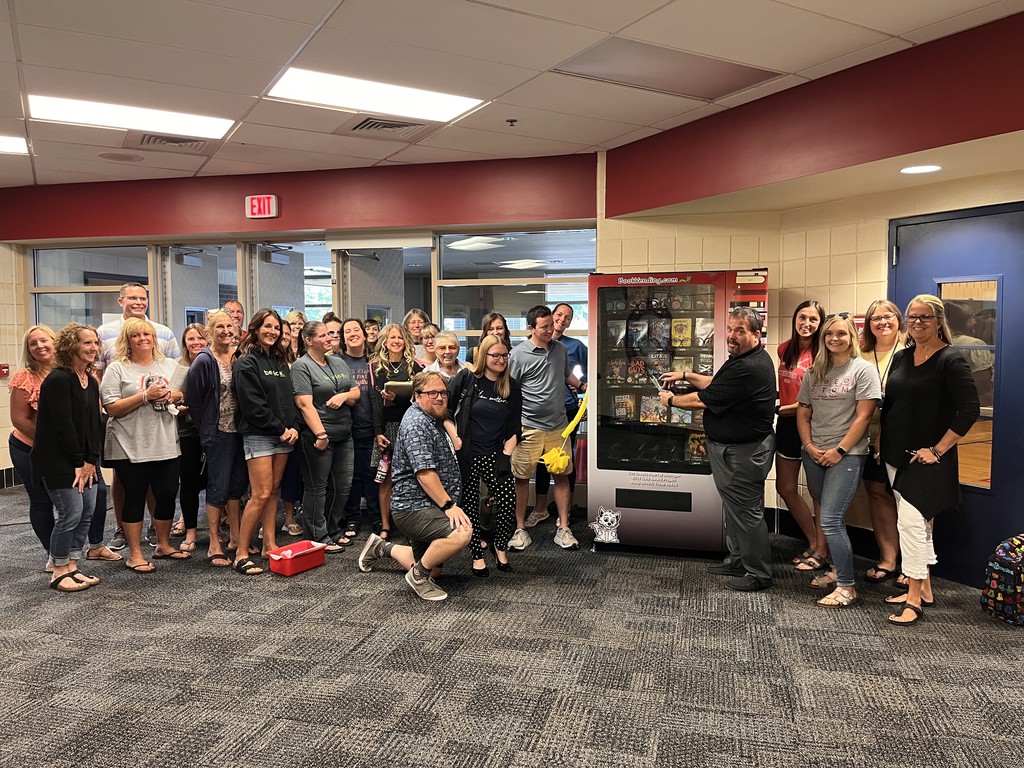 ribbon cutting for Later Elementary book vending machine